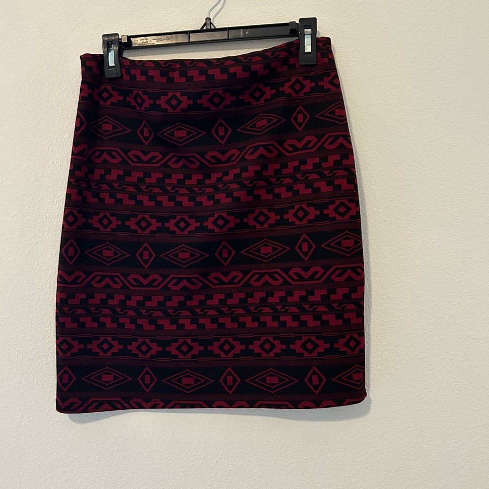 Red and Black Printed Stretchy Skirt. Just above knee-length. Size: Medium